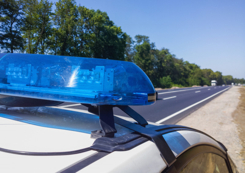 Police-car-on-highway-checking-speed.jpg,0