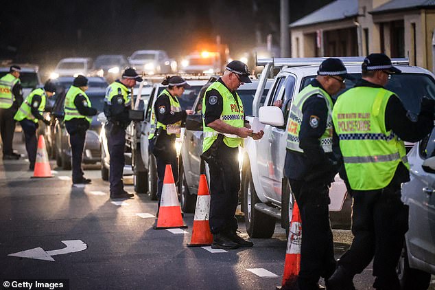 30508578-8504399-A_long_wait_Australians_braved_40_minute_traffic_queues_to_get_t-a-38_1594251709181 (1).jpg,0