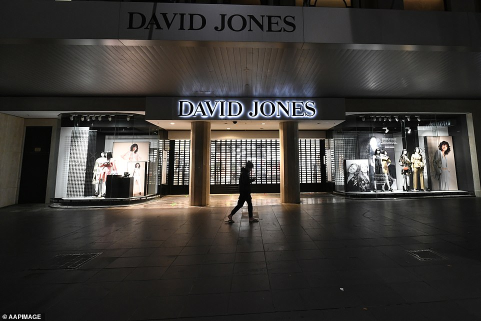 A lone pedestrian walks past David Jones in Bourke Street Mall on Sunday night
