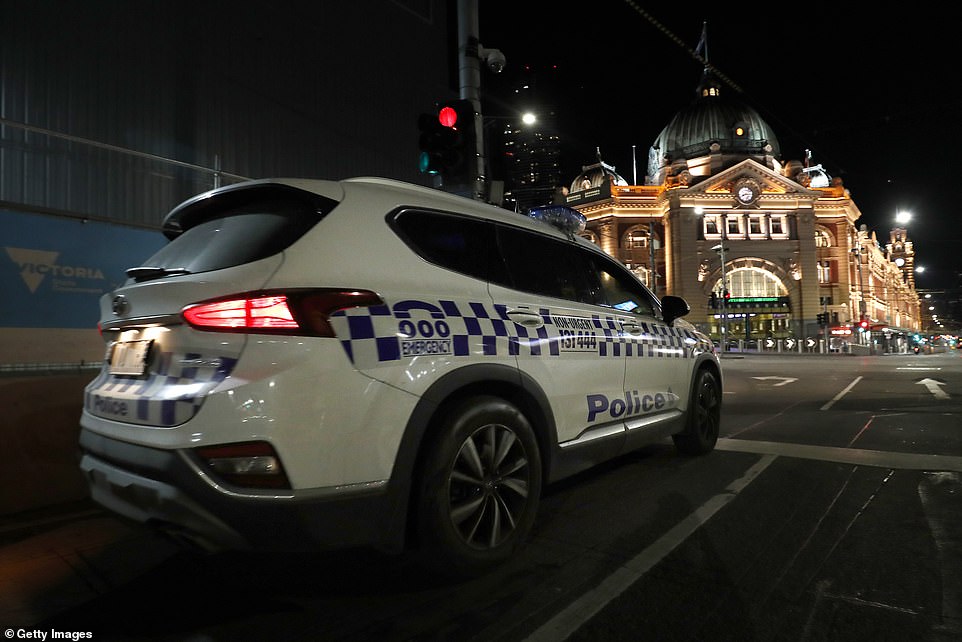 Police were keeping an eye on Melbourne's Federation Square during the first night of evening curfew