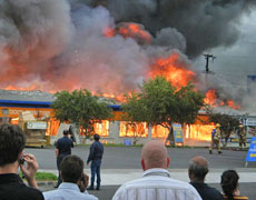 Firefighters battle the huge blaze at a Mitre 10 store in Onehunga last night. Photo / Johno Jorey