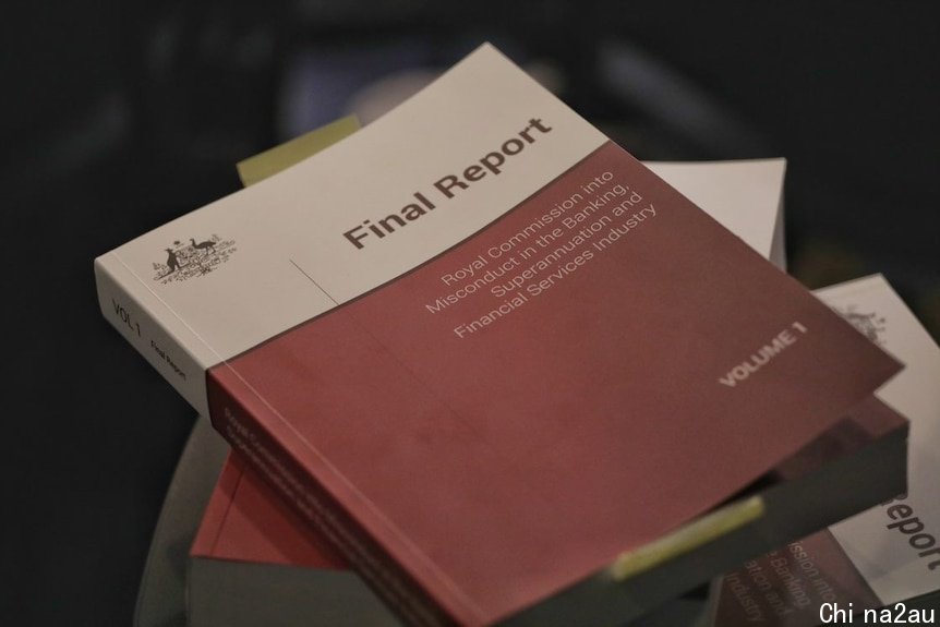 Three volumes of the banking royal commission final report stacked on top of each other