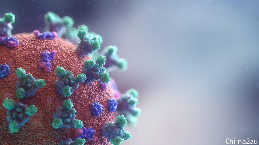 A close-up of the COVID-19 virus as a red ball with green and blue spikes.