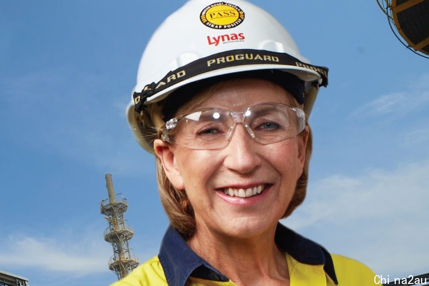 Blonde woman wearing yellow high-vis shirt, white hard hat and safety glasses