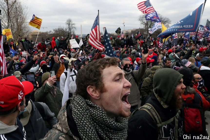 Close up of face of man shouting in a crowd of pro-Trump rioters at the US Capitol in Washington