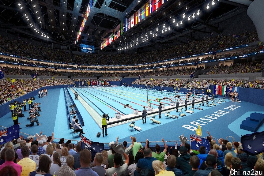 The inside of the swimming arena, showing the pool and crowds.