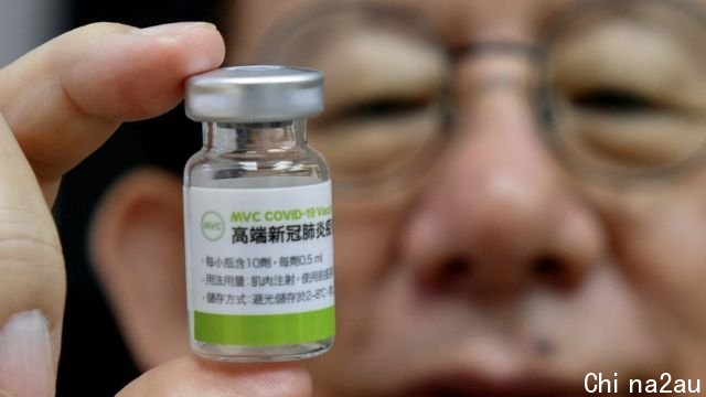 Charles Chen, Chief Executive Officer of Taiwans vaccine maker Medigen Vaccine Biologics Corp (MVC), poses for photographs with a vaccine sample at its headquarters in Taipei on June 16, 2021.
