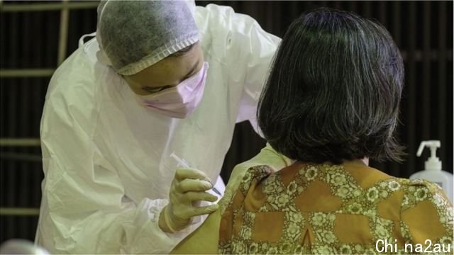 A medical worker administers a jab of Vaxzevria (formerly AstraZeneca) COVID-19 vaccine ahead of the COVID-19 alert Level 3 restriction lift in Taipei