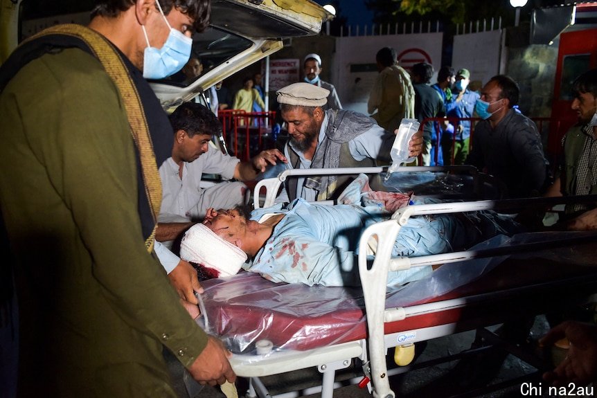 Man on a stretcher arrives at hospital