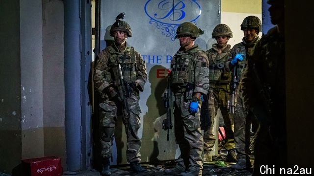 British soldiers secure the perimeter outside the Baron Hotel, on a road that leads to the Abbey Gate, in Kabul, Afghanistan - 26 August 2021