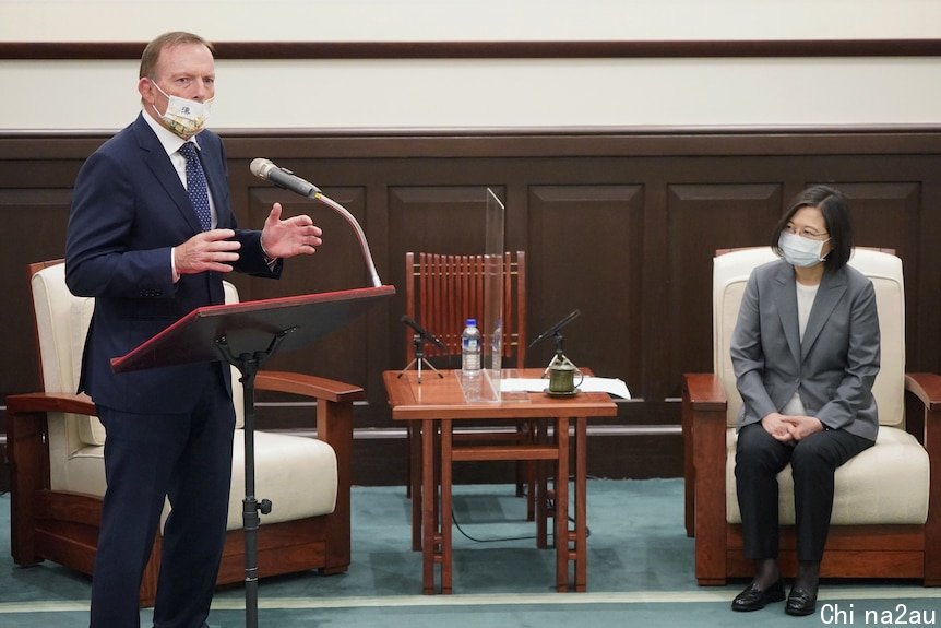 Former prime minister Tony Abbott speaks at an event next to Taiwan's president Tsai Ing-wen, October 2021.