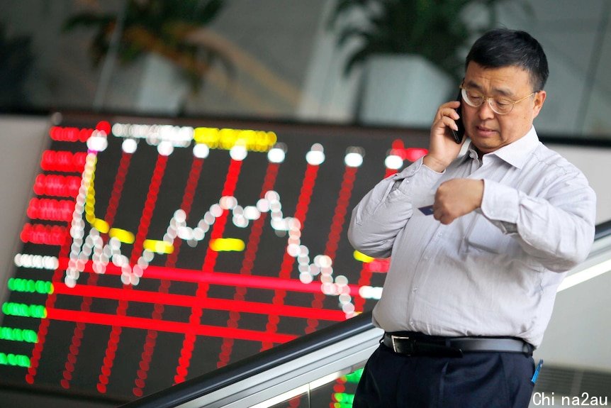 Chinese investor on the phone as market falls