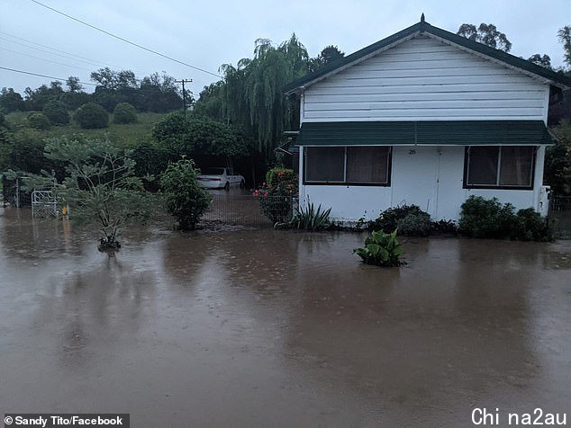 Flood waters slowly rise at a home in Cassilis, central NSW, leaving residents stranded