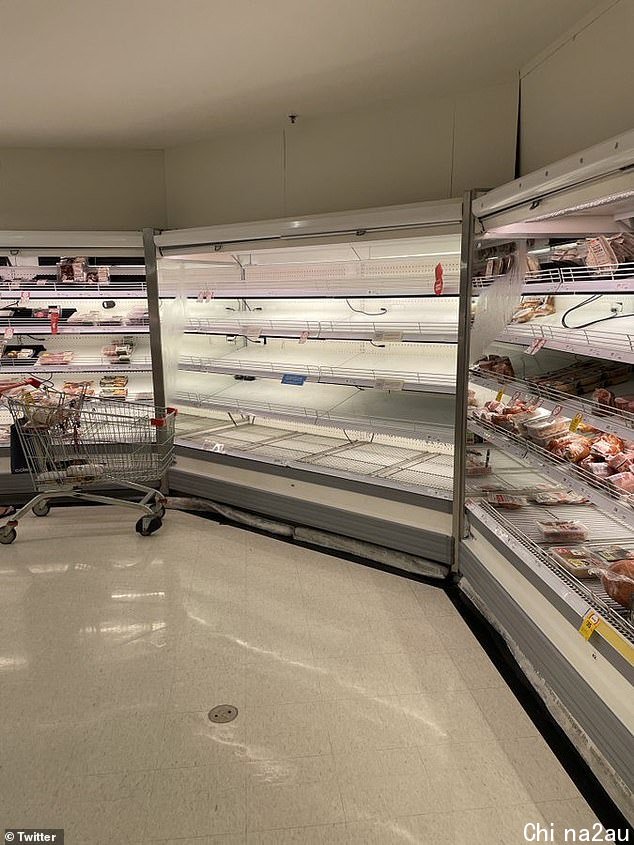 Meat and poultry shelves have been stripped at a Coles as supermarkets battle a staff shortage
