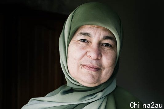 A close up potrait of a woman wearing headscarf