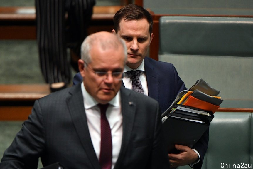 Two men in suits in parliament.