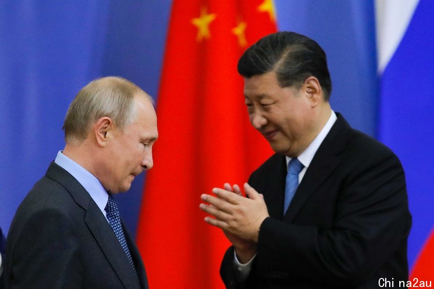 Vladimir Putin (left) looks down as a Xi Jinping smiles at him.
