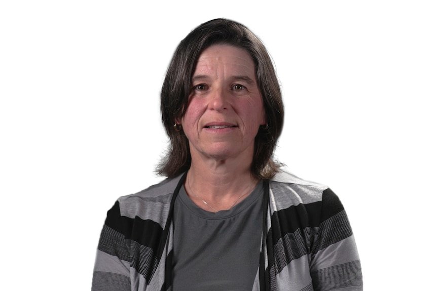 Headshot of a woman wearing a grey and black cardigan, set against white background