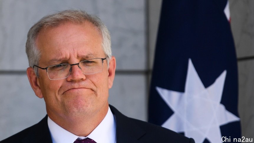 A medium close up shot of the Prime Minister speaking during a press conference