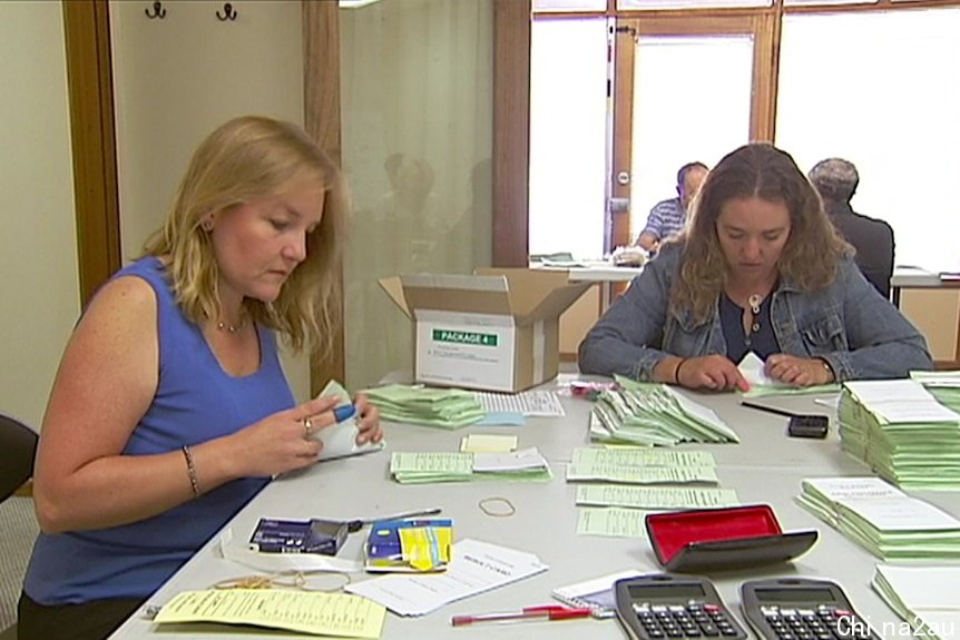 Two women counting votes