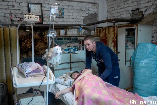 A mother waits to give birth in a hospital basement in Mykolaiv