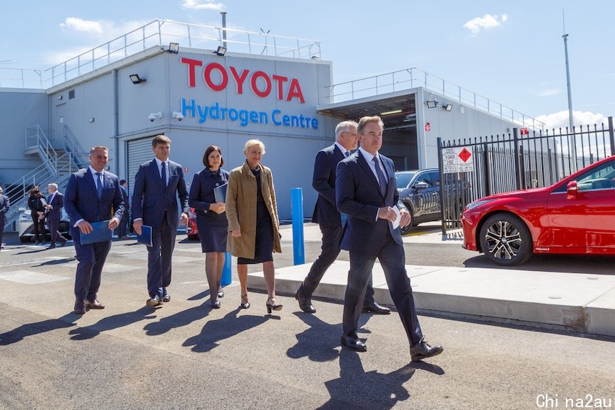 Scott Morrison and Liberal politicians walking outside a Toyota hydrogen factory
