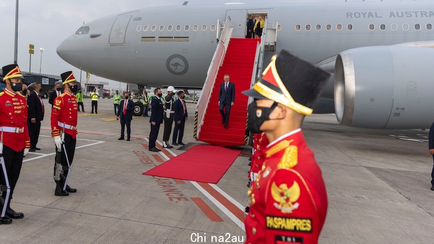 Mr Albanese deboarding the plane.