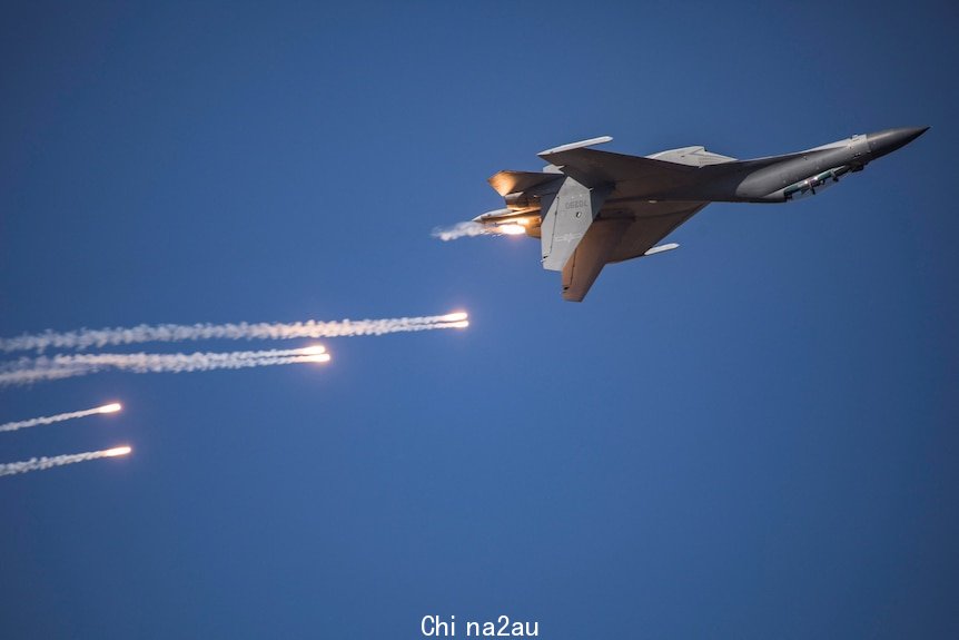 PLA's J-16 fighter jet maneouvres at an air show