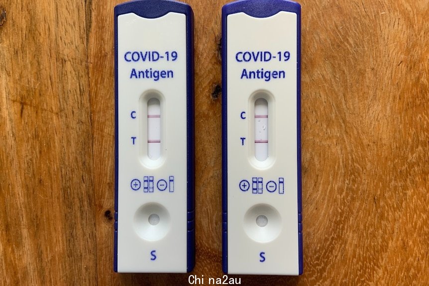 Two rapid antigen tests showing positive results for COVID-19