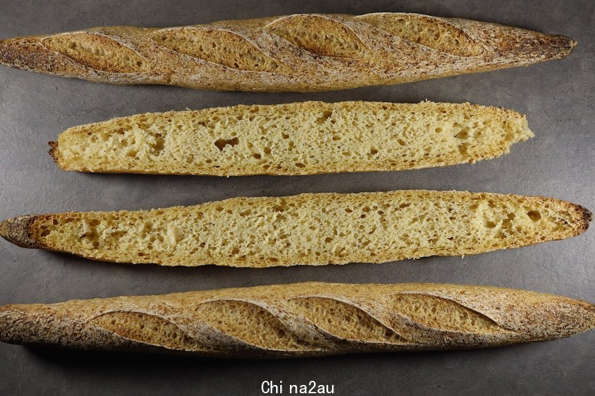 Two cut open baguettes on display, showing both outer crust and inside texture