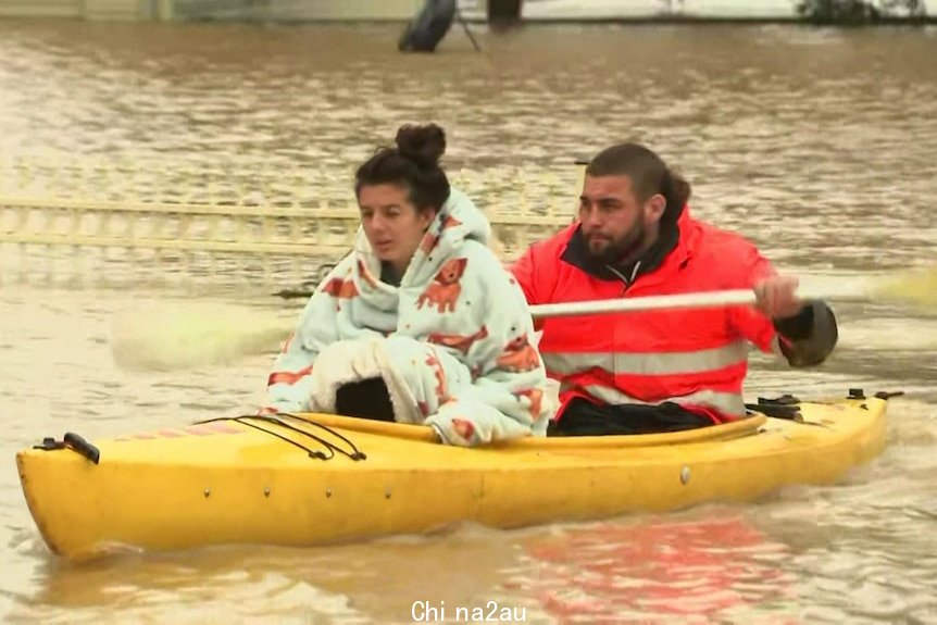 A woman and a man in a canoe