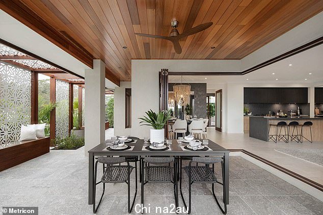 The $1.2million Metricon home in Chisholm, near Newcastle, has a large outdoor dining area (above)