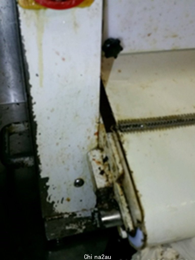 Built up dirt and food residue was also seen inside a pizza dough rolling machine.