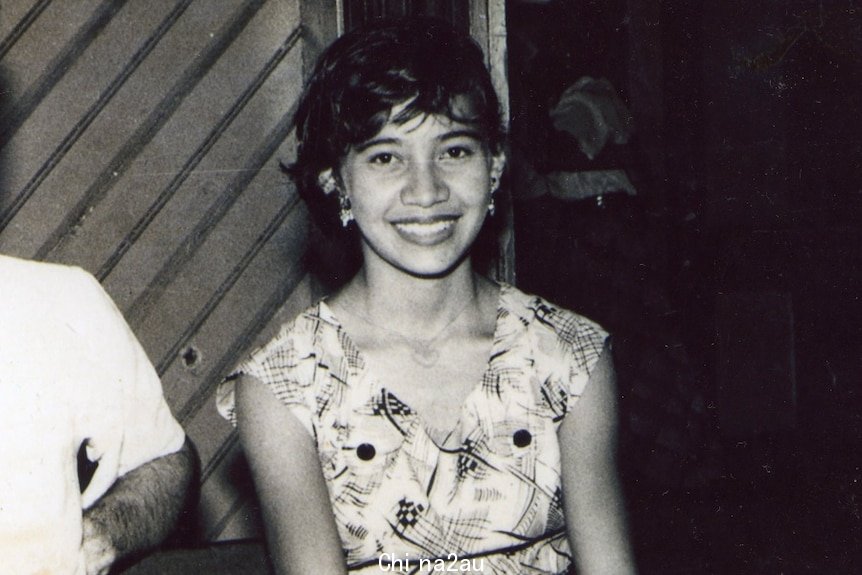 young woman smiles at camera 