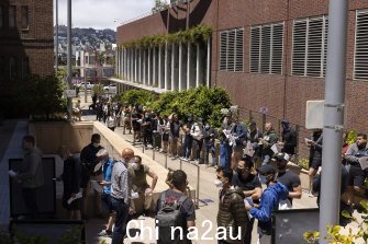 People stand in long lines to receive the monkeypox vaccine at San Francisco General Hospital on July 12, 2022.