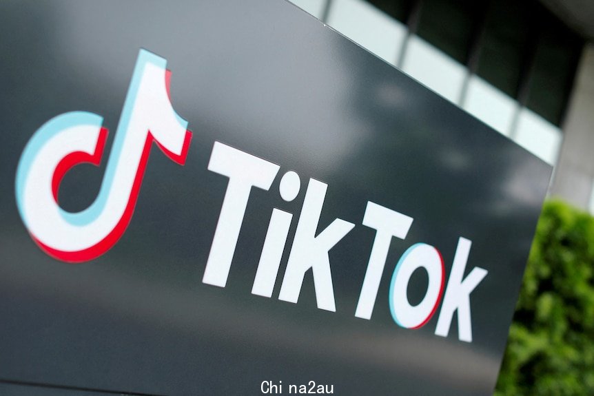 The tiktok logo on a black board