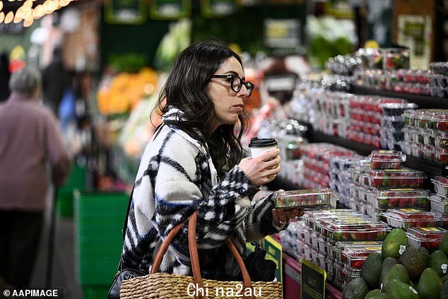 Australian households are expected to take a hit after a sharp rise in annual inflation to 6.1 per cent, its highest rate in 21 years (pictured are shoppers at a Melbourne market)