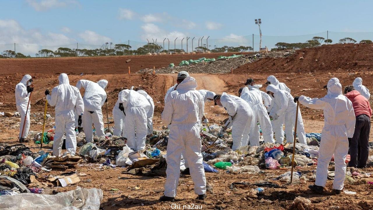 Police search through rubbish at Lower Light for evidence in the murder of Kim Chau. Picture: SAPOL