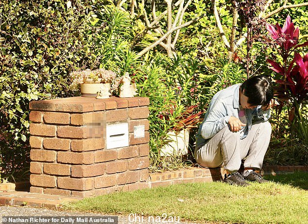 Authorities believe the accused was in a relationship 'for some months' with Jifeng, and all three lived at the Stretton residence (pictured, a mourner near the home on Tuesday)