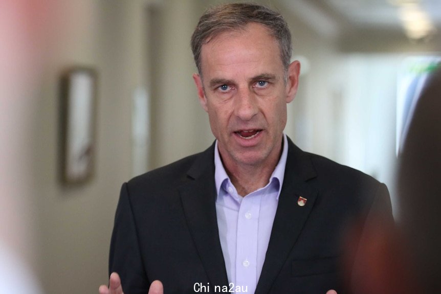 Senator McKim is mid sentence while standing in the Parliamentary Press Gallery.