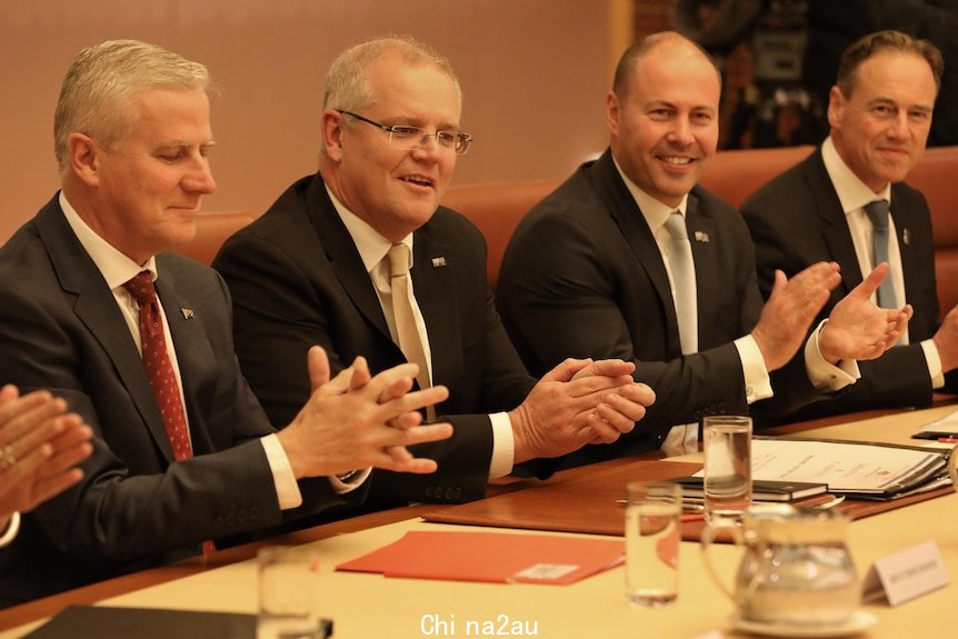 Michael McCormack, Scott Morrison, Josh Frydenberg and Greg Hunt sit in the Cabinet room 