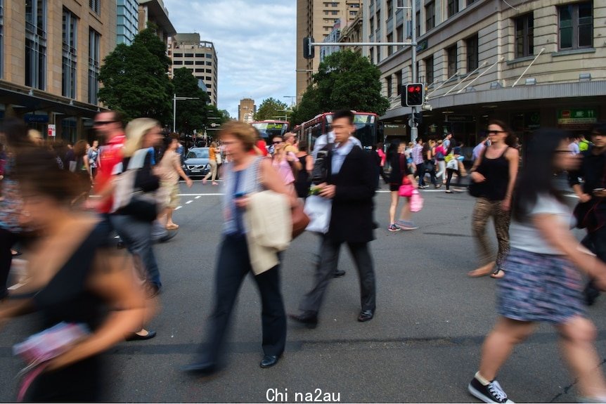 Pedestrians scramble to cross a Sydney street