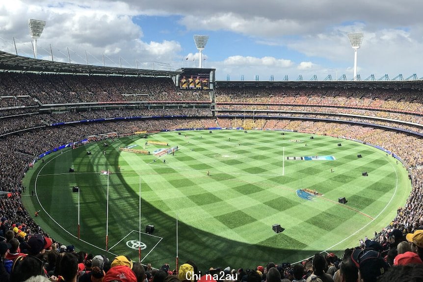 Full AFL stadium overlooking crowd and AFL field
