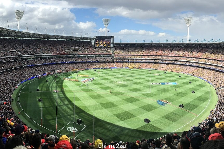 Full AFL stadium overlooking crowd and AFL field