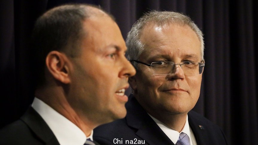 Scott Morrison looks at Josh Frydenberg speaking during