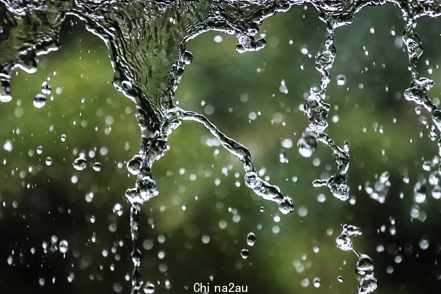 rain cascading off roof