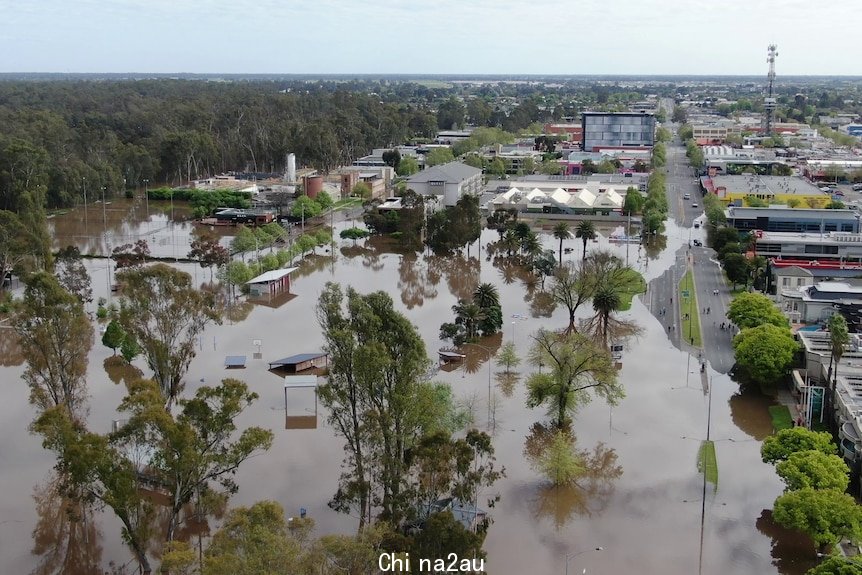 Flood waters encroaching on a town, flooded streets