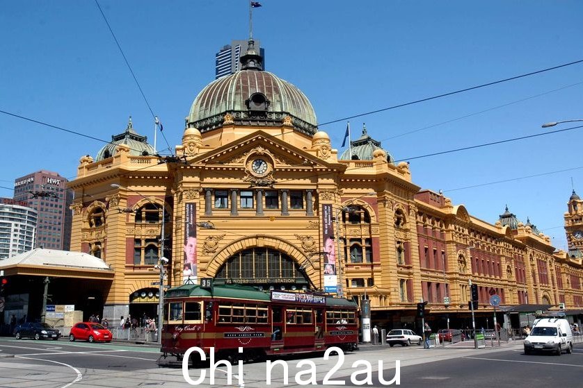 A City Circle tram passes by the front of Flinders Street train station in Melbourne