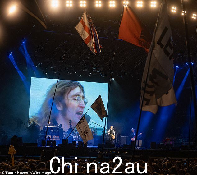 开放:今年早些时候,朱利安讲述了观看他父亲死后与前乐队成员保罗爵士在格拉斯顿伯里的表演是多么困难