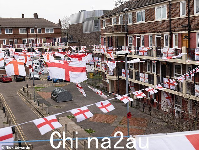 Saint George's Cross flags on display at Kirby Estate, Bermondsey, before the Kirby Estate, Bermondsey, before the England vs Senegal football World Cup Clash